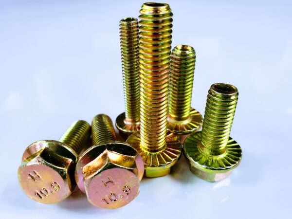 A group of nuts and bolts sitting on top of each other.